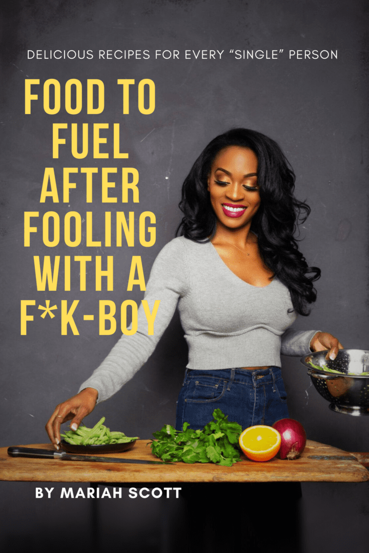 A woman standing in front of some food.